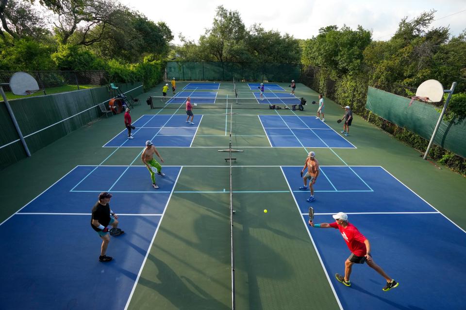 People play pickleball at a house in Rollingwood on Thursday June 29, 2023.  More than 50 people formed a private pickleball club that plays daily at locations in Westlake, Rollingwood and Bee Cave.