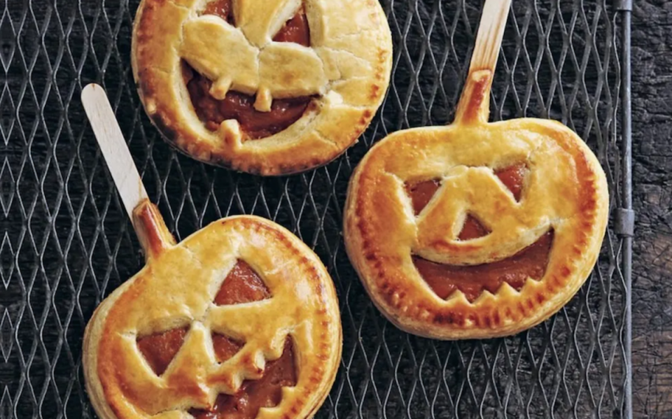 <p>Ryland Peters and Small</p><p>These pumpkin pie pops are a fun Halloween dessert to make with family or friends.</p><p><strong>Get the recipe: <em><a href="https://parade.com/1097273/parade/pumpkin-pie-pops-halloween-recipe/" rel="nofollow noopener" target="_blank" data-ylk="slk:Pumpkin Pie Pops;elm:context_link;itc:0;sec:content-canvas" class="link ">Pumpkin Pie Pops</a></em></strong></p>