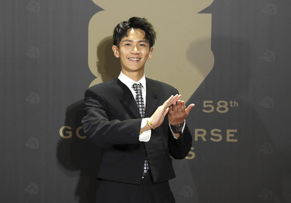 Taiwanese actor Kai Ko arrives at the 58th Golden Horse Awards in Taipei, Taiwan, Saturday, Nov. 27, 2021. Ko is nominated for Best Leading Actor for the film "Man in Love" at this year's Golden Horse Awards, one of the Chinese-language film industry's biggest annual events. (AP Photo/ Billy Dai)