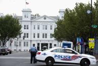 A police vehicle is seen as police respond to a shooting at the Washington Navy Yard, in Washington, September 16, 2013. (REUTERS/Joshua Roberts)