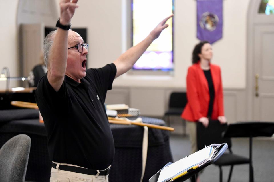 April 17, 2024; Tuscaloosa, AL, USA; Doff Procter and his wife Laurel are retiring from directing the Alabama Choir School. Procter conducts a song during rehearsal at Christ Episcopal Church.