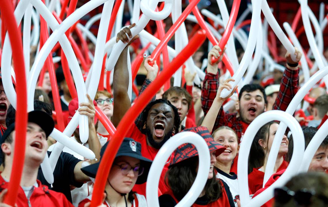 Fans cheer on the Wolfpack before N.C. State’s game against UNC at PNC Arena in Raleigh, N.C., Sunday, Feb. 19, 2023.