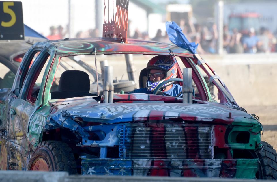 Brad Beaubien drives the car he built for his brother, Craig, during an opening heat in the 6 p.m. show at the Monroe County Fair Demolition Derby.