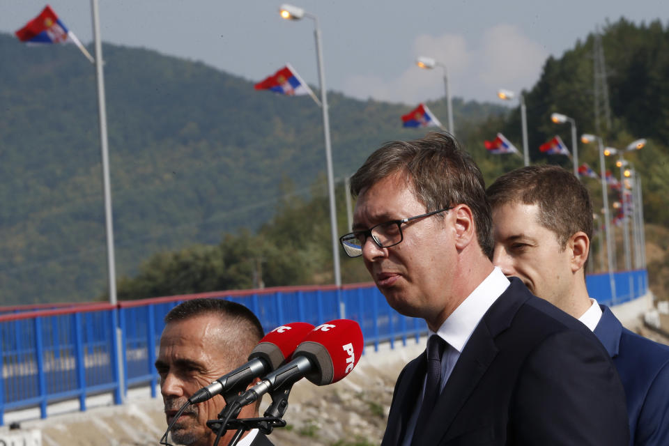 Serbian president Aleksandar Vucic, front, speaks during his visit to the Gazivode Dam near the village of Gazivode, Kosovo on Saturday, Sept. 8, 2018. Vucic is on a two day visit to Kosovo. (AP Photo/Visar Kryeziu)