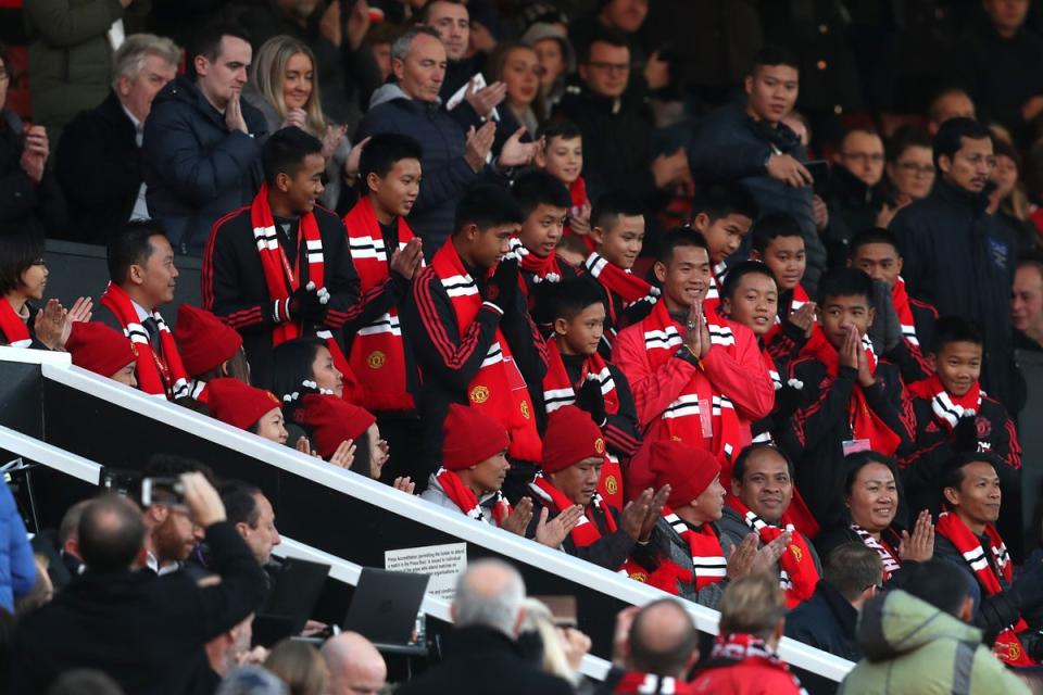 Members of the Thai football team rescued from flooded caves watch Manchester United play (David Davies/PA)