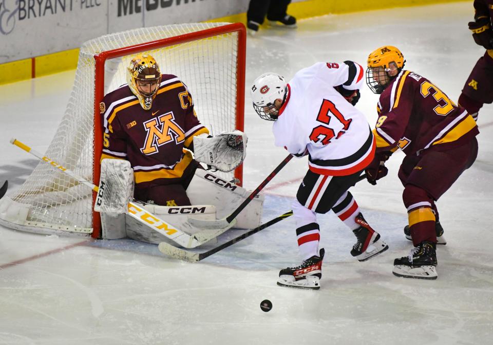 St. Cloud State's Chase Brand takes a shot on goaltender Jack LaFontaine of the University of Minnesota during the game Saturday, Oct. 16, 2021 at the Herb Brooks National Hockey Center in St. Cloud. 