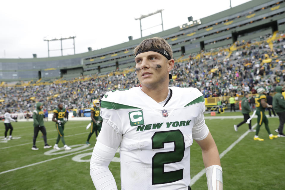 New York Jets quarterback Zach Wilson walks off the field after the second half of an NFL football game against the Green Bay Packers, Sunday, Oct. 16, 2022, in Green Bay, Wis. (AP Photo/Matt Ludtke)