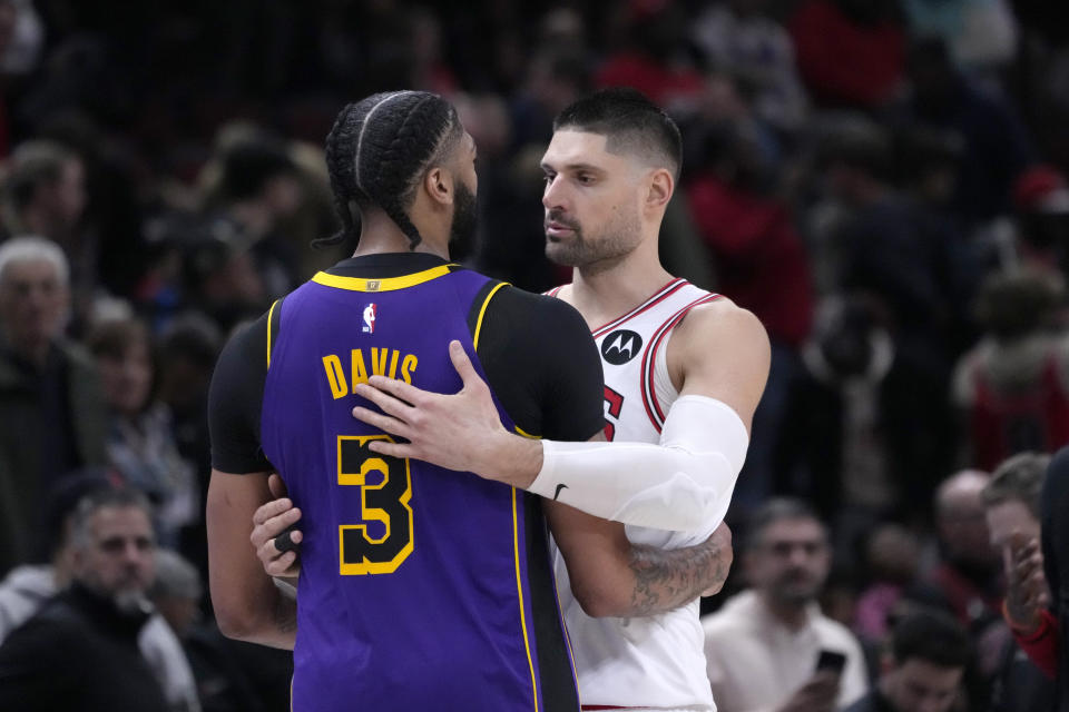 Los Angeles Lakers' Anthony Davis and Chicago Bulls' Nikola Vucevic talk after an NBA basketball game Wednesday, March 29, 2023, in Chicago. The Lakers won 121-110. (AP Photo/Charles Rex Arbogast)