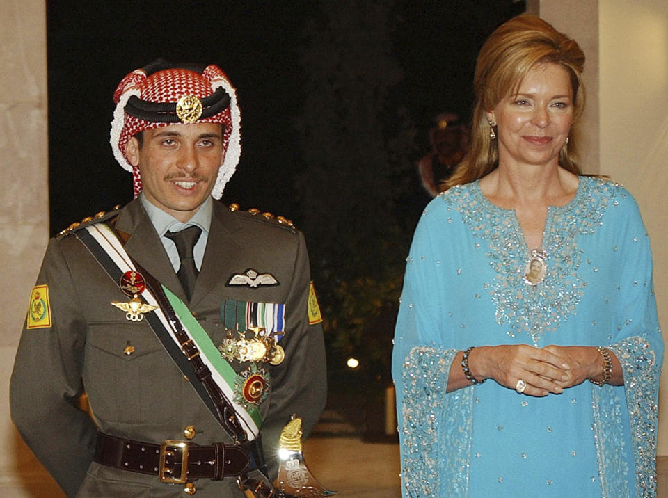 FILE - Jordan's then Crown Prince Hamzeh, left, with his mother then Queen Noor, during his wedding ceremony in Amman, Jordan, May 27, 2004. Prince Hamzeh, the half-brother of Jordan’s king, posted a letter on his official Twitter account on Sunday, April 3, 2022, relinquishing his princely title, a year after a rare palace feud saw him placed under house arrest. (AP Photo/Hussein Malla, File)