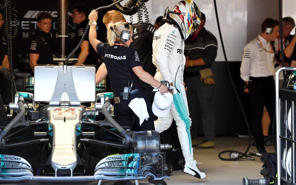 Furious Lewis Hamilton storms out of his car - AFP POOL