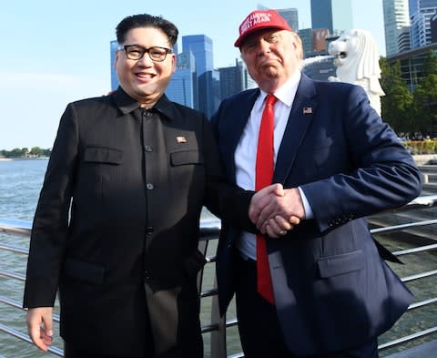 Kim Jong-un and Donald Trump impersonators pose in Singapore, the location of a historic summit between the two leaders - Credit: Roslan Rahman/AFP