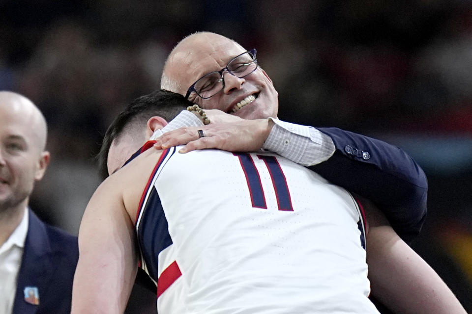 UConn head coach Dan Hurley hugs forward Alex Karaban during the second half of the NCAA college Final Four championship basketball game against Purdue, Monday, April 8, 2024, in Glendale, Ariz. (AP Photo/Brynn Anderson)