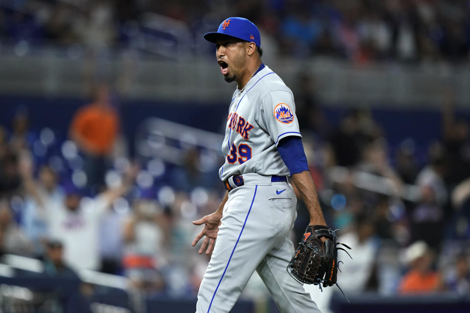 New York Mets relief pitcher Edwin Diaz exults after the team's baseball game against the Miami Marlins, Friday, June 24, 2022, in Miami. The Mets won 5-3. (AP Photo/Lynne Sladky)