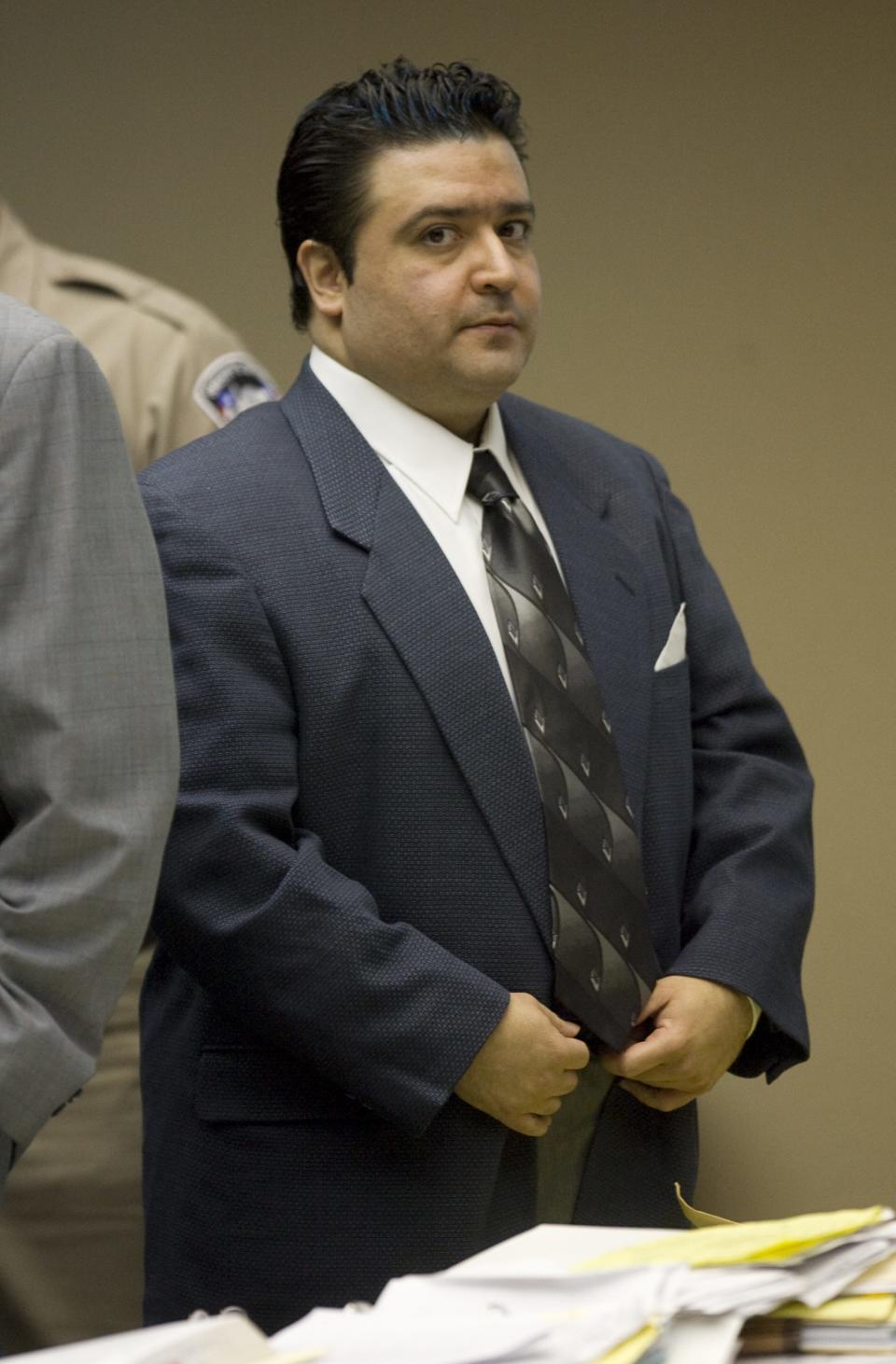 2008 Convicted killer David Renteria looks in the direction of the jury as a recess is called after his mother broke down during questioning of his resentencing trial.