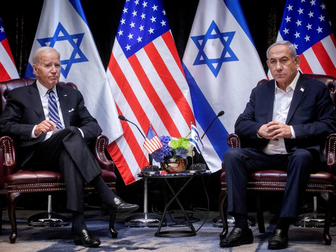 U.S. President Joe Biden, left, pauses during a meeting with Israeli Prime Minister Benjamin Netanyahu to discuss the war between Israel and Hamas in Tel Aviv, Israel on Wednesday, Oct. 18, 2023. (Miriam Alster/Reuters - image credit)