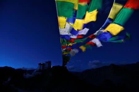 Prayer flags stretch towards Tsemo Monastery in the city of Leh, the largest town in the region of Ladakh, nestled high in the Indian Himalayas, India September 26, 2016. REUTERS/Cathal McNaughton