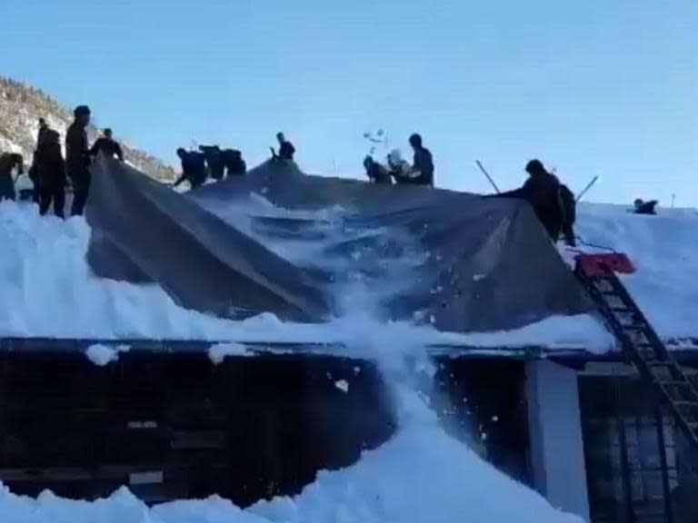 Austrian armed forces find clever way to clear snow from roofs amid extreme weather