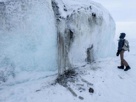 Melinda Webster examines a fragment of multiyear ice (Bonnie Jo Mount)