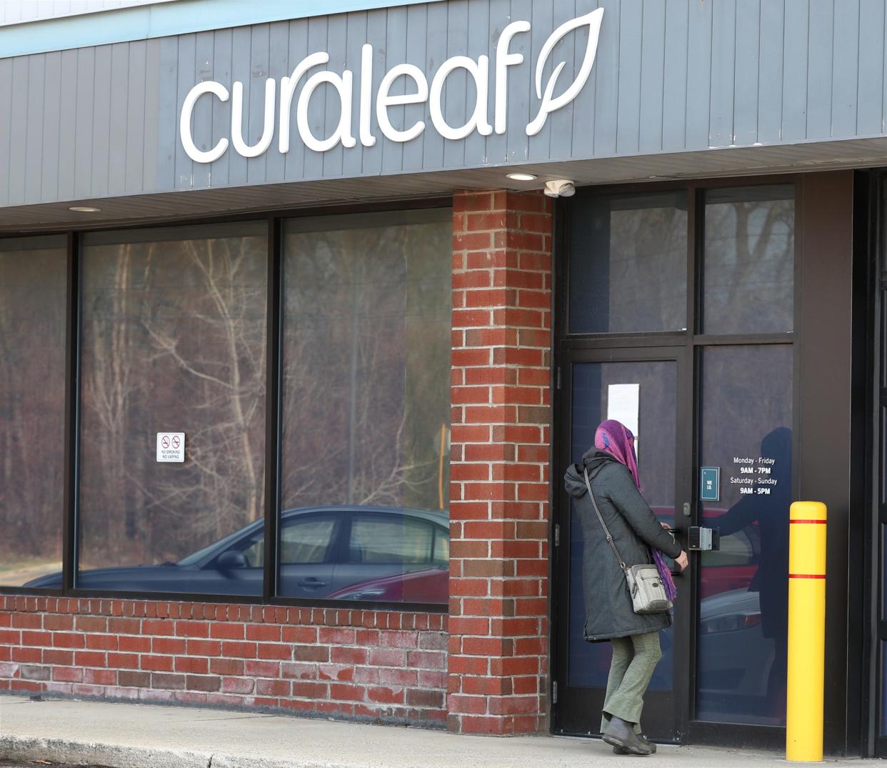 Medical marijuana patient Hannah Smagola, 26, of Cuyahoga Falls enters Curaleaf, a medical marijuana dispensary. Smagola, who has a brain tumor, says she supports legalizing recreational marijuana and looks forward to growing her own cannabis.