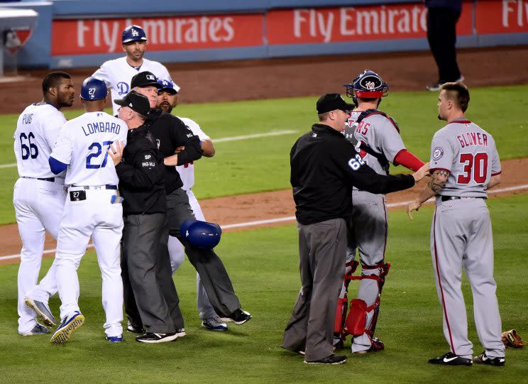 Yasiel Puig and Koda Glover were separated before anything could happen. (Getty Images)