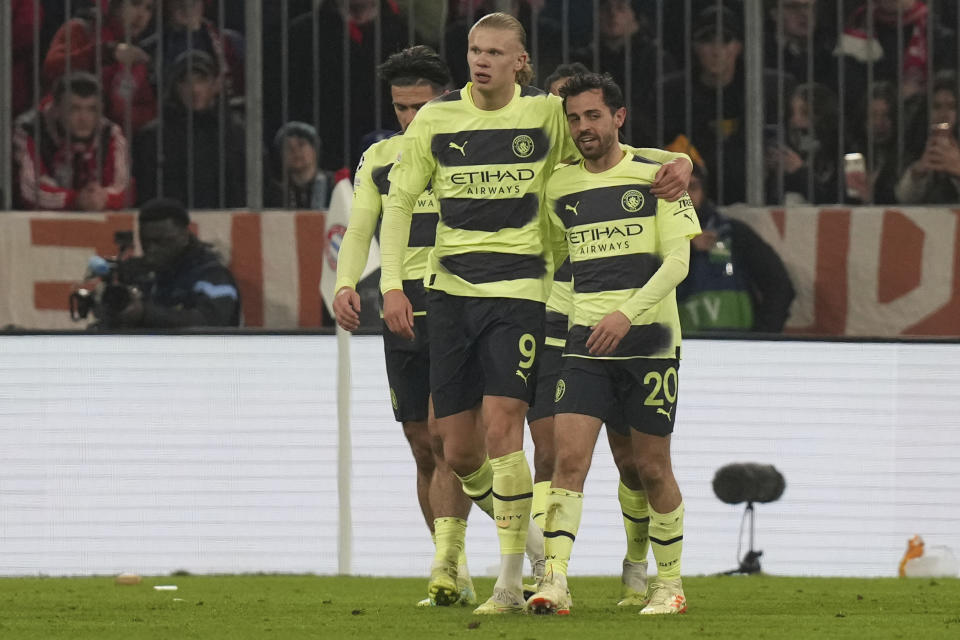 Manchester City's Erling Haaland, centre, celebrates after scoring his side's opening goal during the Champions League quarter final second leg soccer match between Bayern Munich and Manchester City, at the Allianz Arena stadium in Munich, Germany, Wednesday, April 19, 2023. (AP Photo/Matthias Schrader)