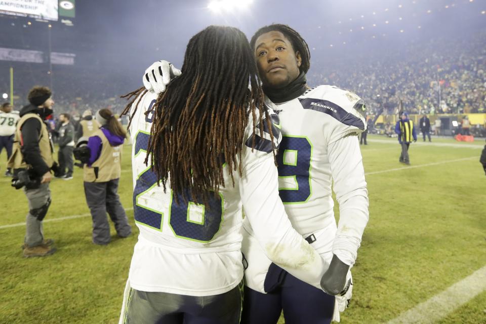 Seattle Seahawks' Shaquem Griffin and Shaquill Griffin embrace after an NFL divisional playoff football game against the Green Bay Packers Sunday, Jan. 12, 2020, in Green Bay, Wis. The Packers won 28-23 to advance to the NFC Championship. (AP Photo/Darron Cummings)