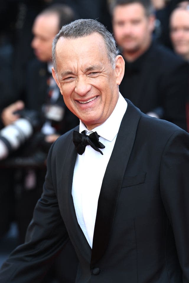 Tom Hanks smiling in a tuxedo