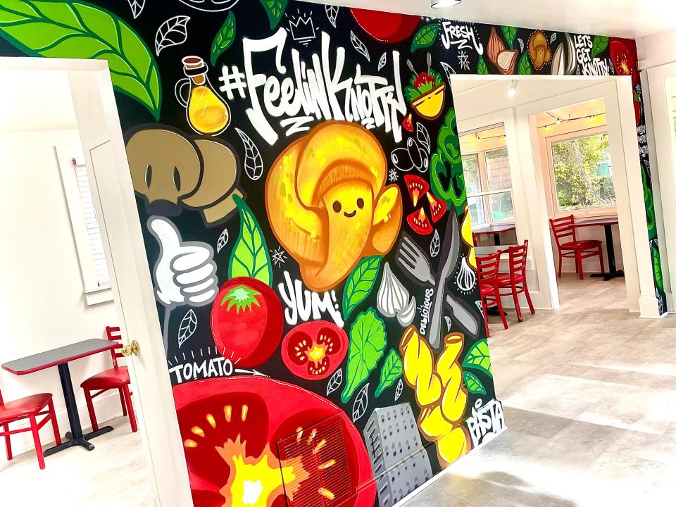 Customized graffiti wall inside The Knot House, coming soon to New Smyrna Beach.