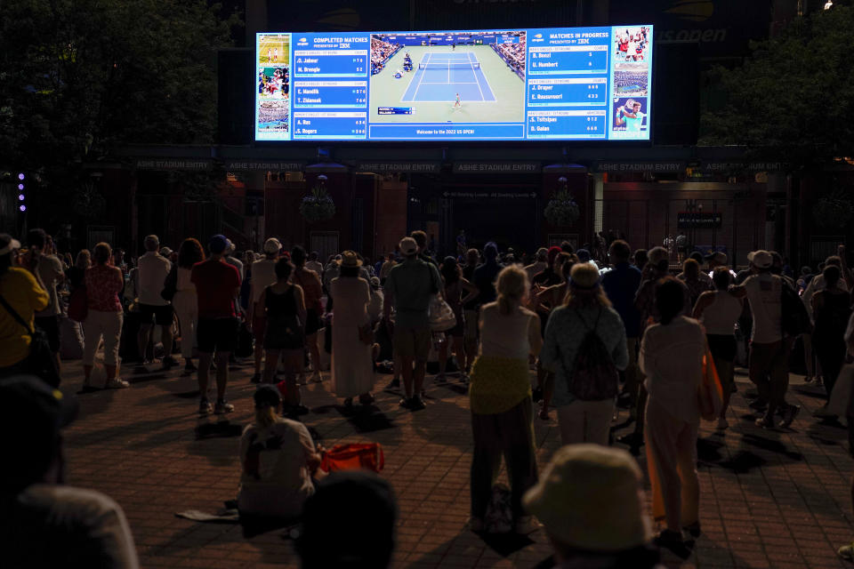 Tennis fans watch play between Serena Williams, of the United States, and Danka Kovinic, of Montenegro, during the first round of the US Open tennis championships, Monday, Aug. 29, 2022, in New York. (AP Photo/Julia Nikhinson)