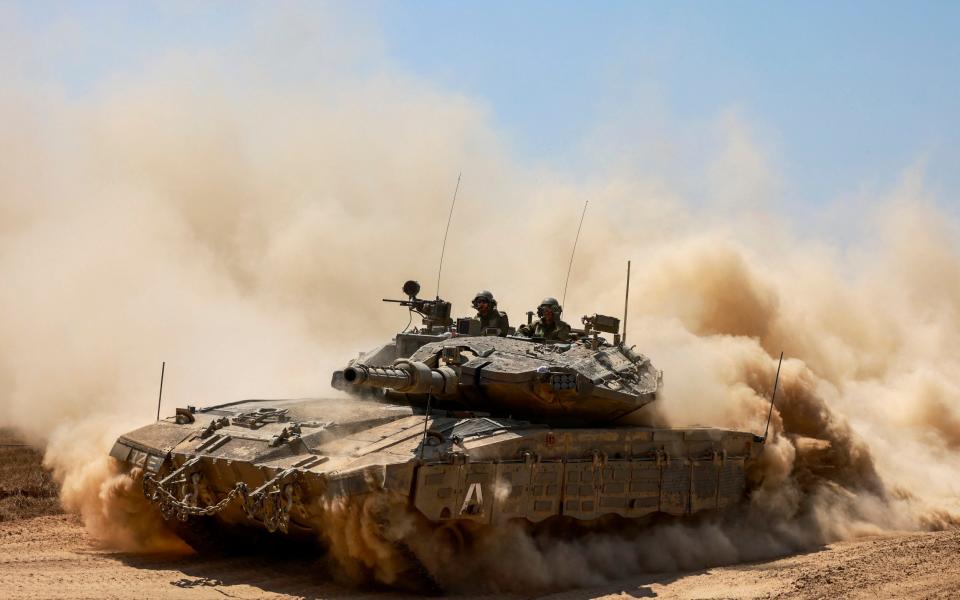 Israeli tank rolling along Israel's border with Gaza