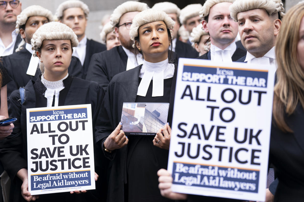 Criminal barristers from the Criminal Bar Association (CBA), which represents barristers in England and Wales, outside the Old Bailey, central London, on the first of several days of court walkouts by CBA members in a row over legal aid funding. Picture date: Monday June 27, 2022.