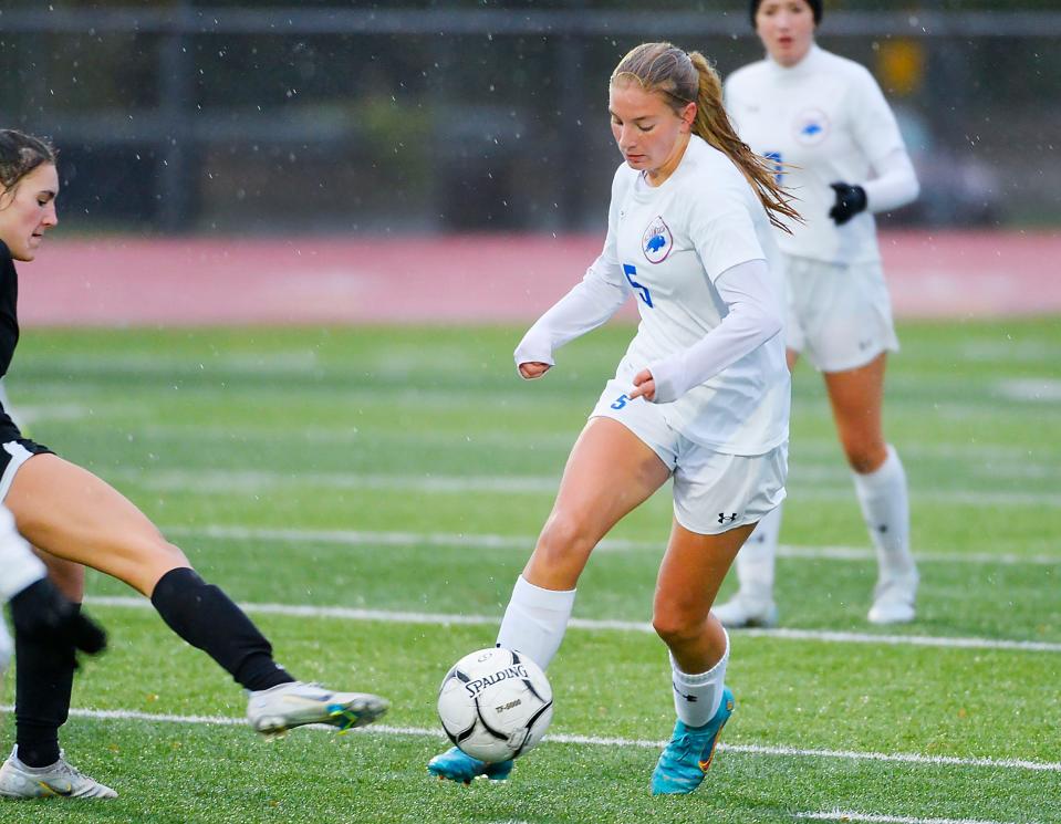Fort LeBoeuf's Emily Samluk dribbles past a defender during a 2022 game against Harbor Creek. Samluk is one of seven returning all-District 10 girls soccer players this fall.