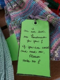 Each item distributed by the Scarf Project is tagged with information that lets people know why they are hanging outside.