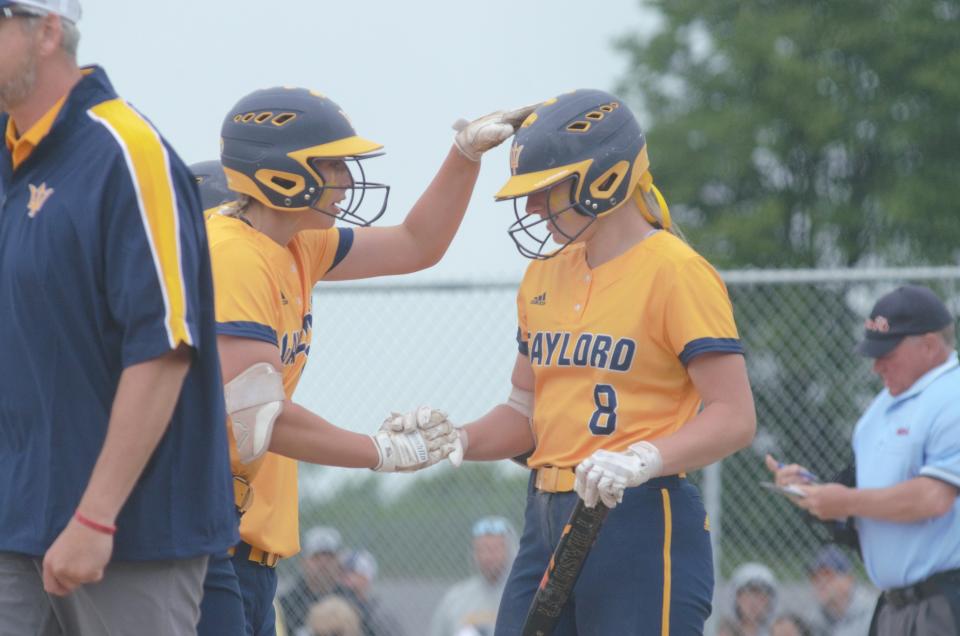 Jayden Jones gives Alexis Kozlowski support prior to a big at-bat during the Division 2 Region 9 Finals on Saturday, June 11.