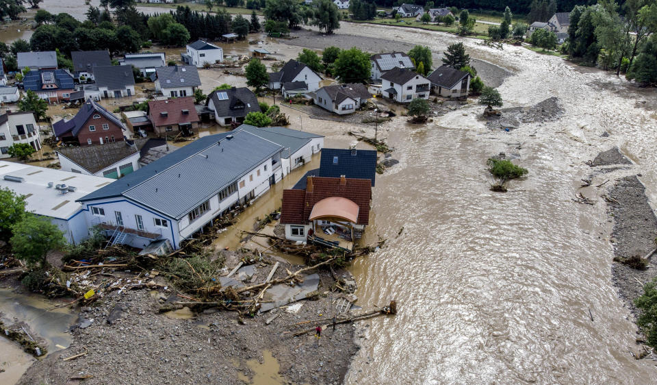 Image: Damaged houses are seen at the Ahr river in Insul, western Germany (Michael Probst / AP)