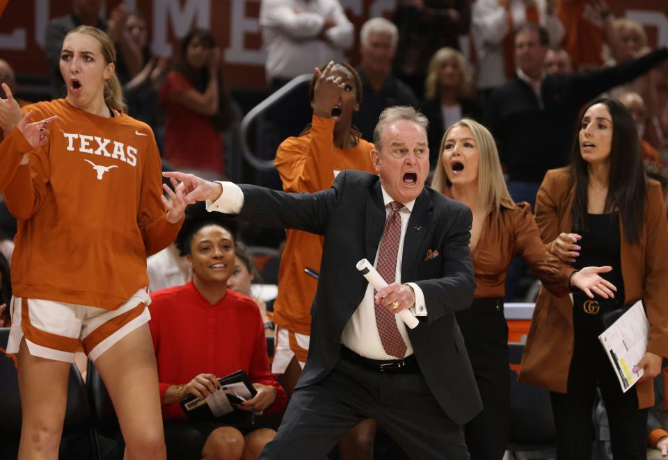 Texas head coach Vic Schaefer, front right, reacts to a call during a game against Baylor in February in Austin.