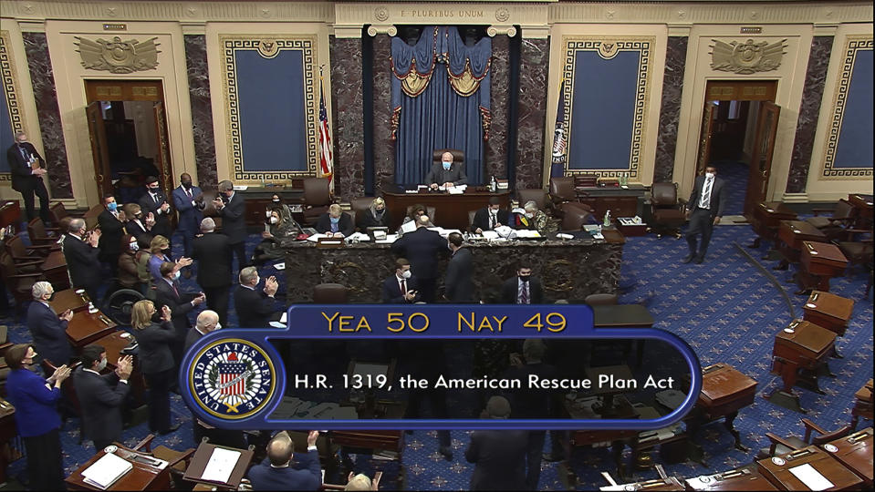 In this image from video, the vote total of 50-49 on Senate passage of the COVID-19 relief bill, is displayed on screen in the Senate at the U.S. Capitol in Washington, Saturday, March 6, 2021. (Senate Television via AP)