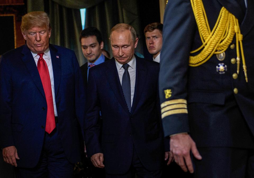 <p>U.S. President Donald Trump and Russia’s President Vladimir Putin arrive for a meeting at Finland’s Presidential Palace on July 16, 2018 in Helsinki, Finland. (Photo: Brendan Smialowski/AFP/Getty Images) </p>