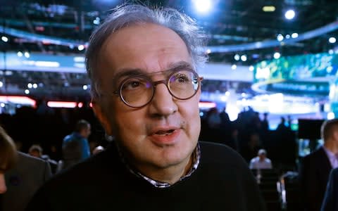 Fiat Chrysler Automobiles CEO Sergio Marchionne is interviewed after the unveiling of the new 2019 Jeep Cherokee during the North American International Auto Show, Tuesday, Jan. 16, 2018, in Detroit. Marchionne said a day earlier that he'll step down in 2019, after leading the combined company since 2009. (AP Photo/Carlos Osorio) - Credit: Carlos Osorio/AP