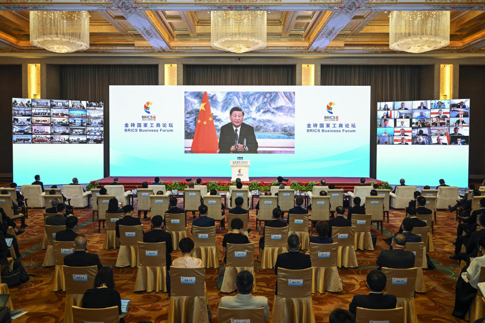 In this photo released by Xinhua News Agency, Chinese President Xi Jinping delivers a keynote speech in virtual format at the opening ceremony of the BRICS Business Forum on Wednesday, June 22, 2022. The conflict in Ukraine has "sounded an alarm for humanity," Chinese leader Xi Jinping said Wednesday, as China continues to assume a position of neutrality while backing its ally Russia. (Yin Bogu/Xinhua via AP)