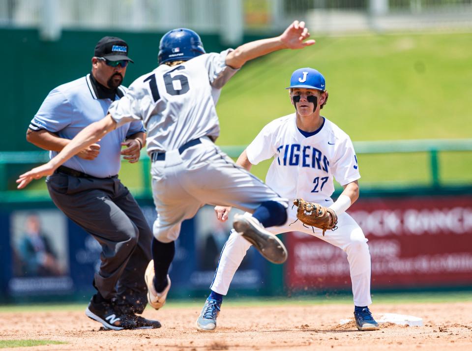 Rollie Craig of Naples High School tries to get around Jacob Lozano of Tampa Jesuit during a state semifinal baseball game between Tampa Jesuit and Naples at Hammond Stadium in Fort Myers on Thursday,May 19, 2022. Naples lost 5-2. Craig was out.