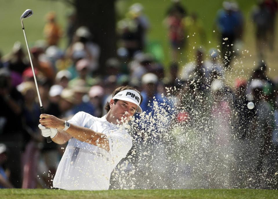 Bubba Watson hits out of a bunker on the seventh hole during the fourth round of the Masters golf tournament Sunday, April 13, 2014, in Augusta, Ga. (AP Photo/Chris Carlson)