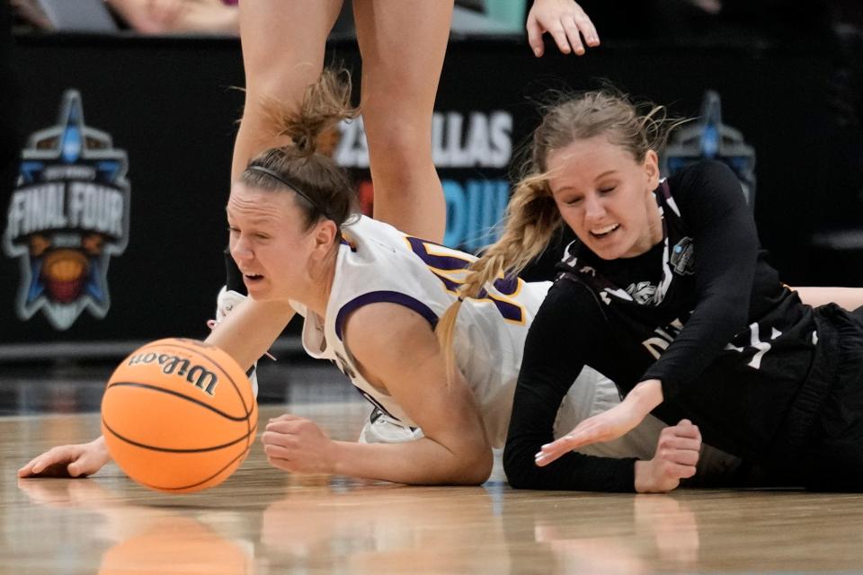 Ashland's Hallie Heidemann and Minnesota Duluth's Maesyn Thiesen go after a loose ball during the first half of an NCAA Women's Division 2 championship basketball game Saturday, April 1, 2023, in Dallas. (AP Photo/Morry Gash)