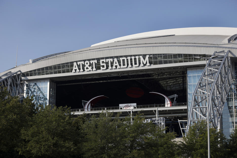 FILE - The outside of AT&T Stadium is shown with the end zone doors open before an NFL football game between the Dallas Cowboys and the Cleveland Browns in Arlington, Texas, Sunday, Oct. 4, 2020. The NFL, not surprisingly in the midst of a rise in COVID-19 cases, has looked into other potential sites for next month's Super Bowl. AT&T Stadium in Arlington, Texas, the home of the Dallas Cowboys, reportedly is one of the facilities contacted. (AP Photo/Ron Jenkins, File)