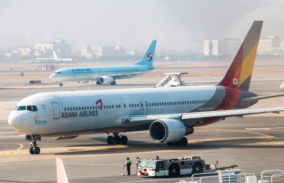 image of Asiana Airlines plane on tarmac