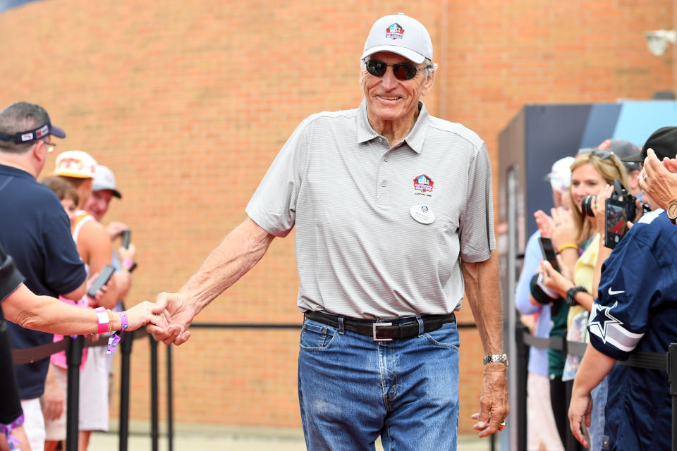 CANTON, OH - AUGUST 06: Hall of Fame linebacker Dave Wilcox celebrates with fans as he is introduced prior to the Pro Football Hall of Fame Enshrinement on August 06, 2022 in Canton, Ohio. (Photo by Nick Cammett/Diamond Images via Getty Images)