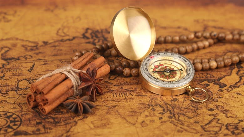 Cinnamon sticks and vintage compass