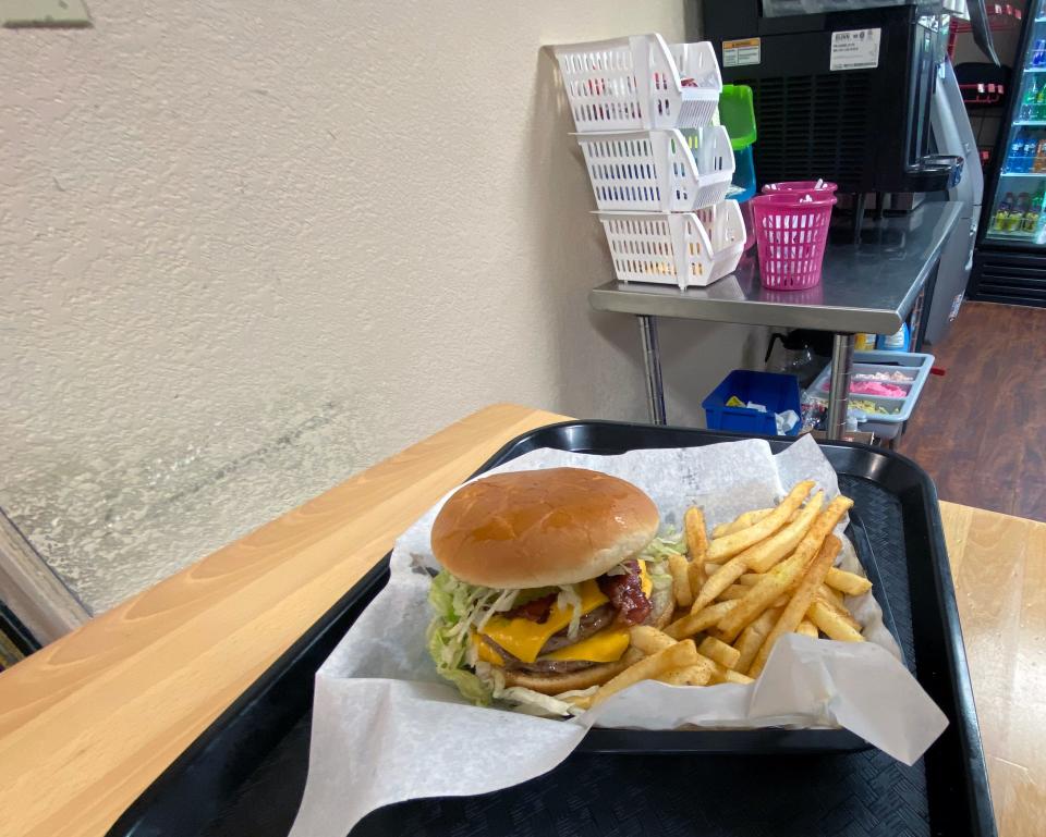 A freshly made hamburger and fries from The Little Store and Kitchen in Sherman.