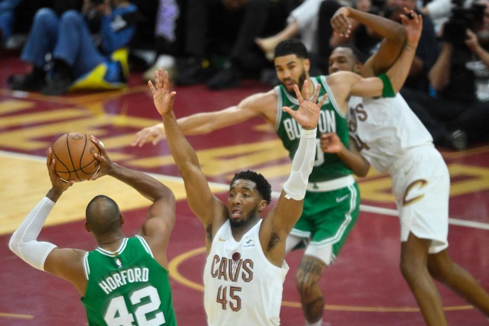 Celtics center Al Horford controls the ball against Cavaliers guard Donovan Mitchell in the third quarter of Game 3 of the Eastern Conference semifinals, May 11, 2024, in Cleveland.
