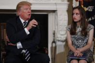 U.S. President Donald Trump speaks next Marjory Stoneman Douglas High School student Carson Abt, as the president hosts a listening session with high school students and teachers to discuss school safety at the White House in Washington, U.S., February 21, 2018. REUTERS/Jonathan Ernst